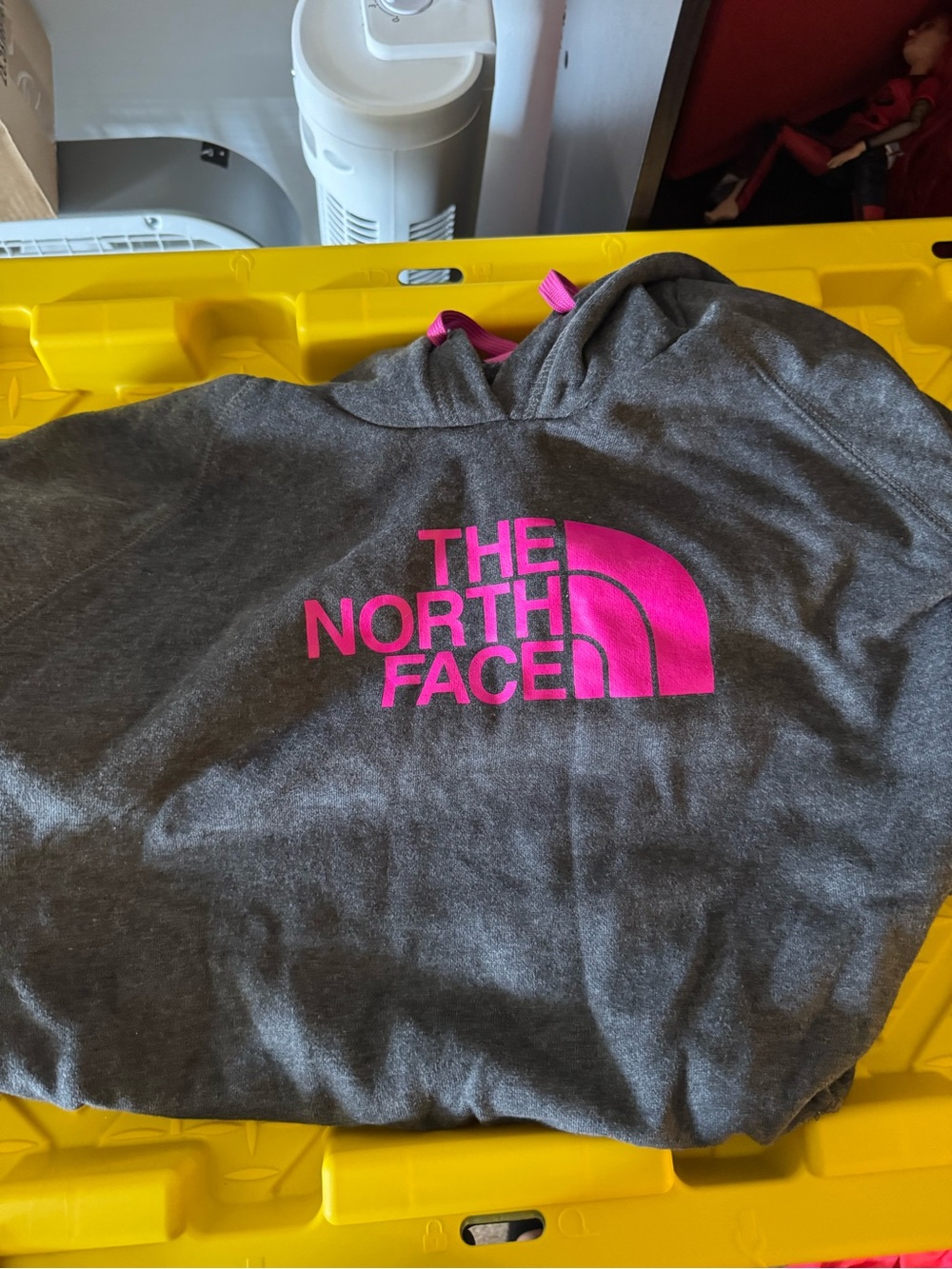 The North Face women’s Gray Hoodie with Pink Logo